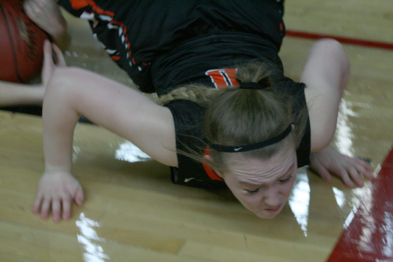 Point guard Kiara Cross dives for the ball during a state playoff game against Lynden on Feb.