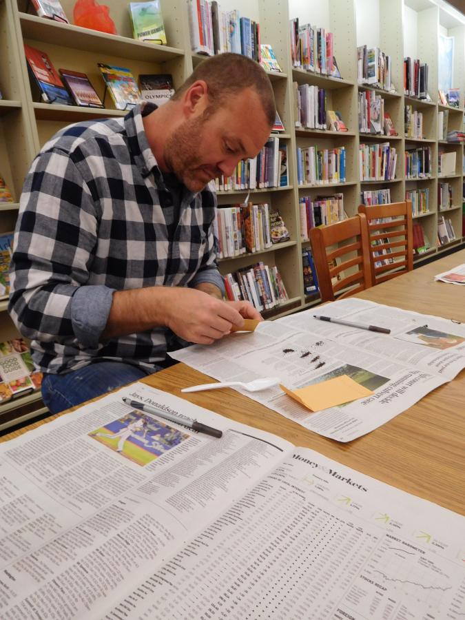 Master Gardener James Stupfel, of Camas, sorts heirloom seeds for a new seed library at the Washougal Community Library, on Feb. 22. Local residents can check out vegetable and flower seeds, plant them and watch them grow. When it is time to harvest, seed library participants are asked to let one or two plants go to seed and bring some of the seeds back to the library for other gardeners to plant.