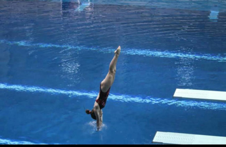 Camas diver Shea McGee enters the water during a recent practice dive at Tualatin HIlls Aquatics Center in Beaverton, Ore.