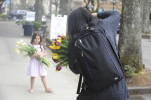 Tonya Wright utilizes downtown Camas as a backdrop for photos of Priscilla Fiscu. Wright created her business, Nest & Love Photography, one year ago.