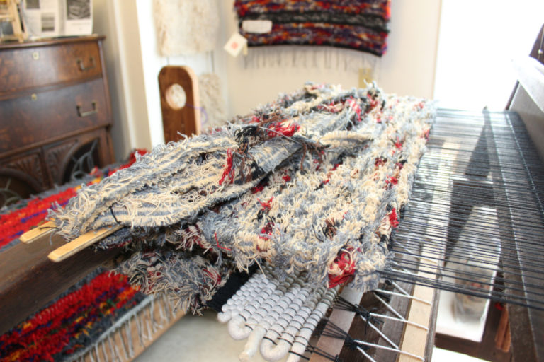 A working, antique weaving loom inside the Two Rivers Heritage Museum.