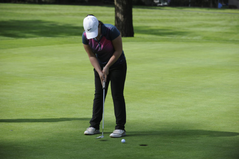 Kallie Sakamoto taps in for par during an April 9 tournament against Black Hills at Orchard Hills Country Club in Washougal.