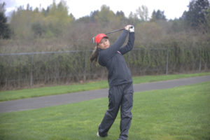 Photos by Wayne Havrelly/Post-Record 
 Camas senior Lauren Tsukimura competes at the Titan Cup at Tri Mountain Golf Course in Ridgfield on Monday, April 16.