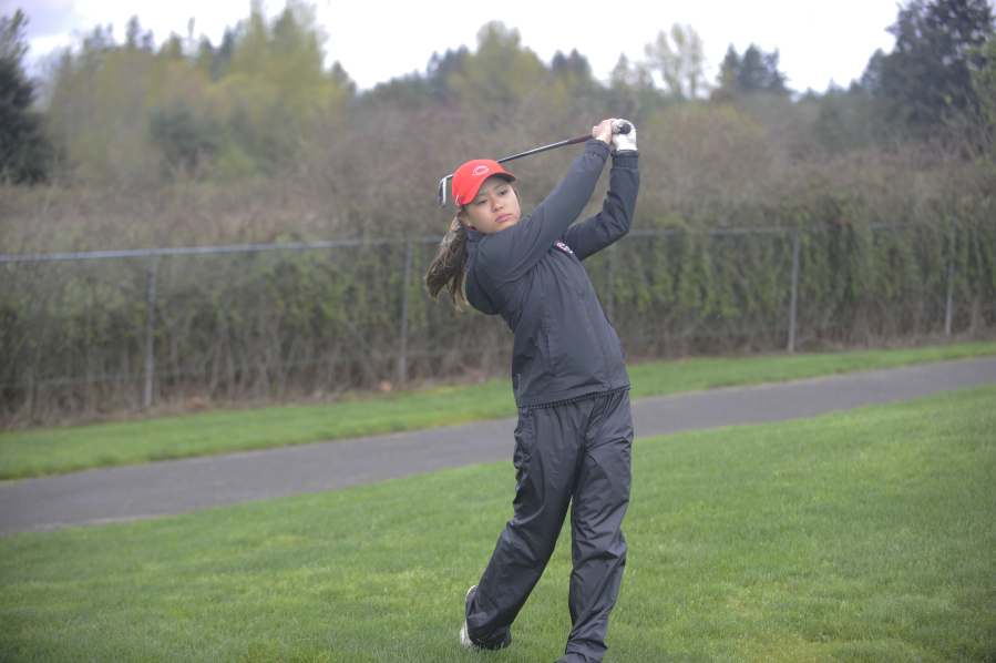 Photos by Wayne Havrelly/Post-Record 
 Camas senior Lauren Tsukimura competes at the Titan Cup at Tri Mountain Golf Course in Ridgfield on Monday, April 16.
