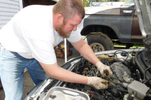 Tom Farris, owner of Farris Automotive Repair, reseals an engine and provides a tune-up on a Mercury Cougar, at his home garage in Washougal. He provides pre-buy inspections of used cars and courtesy inspections of fluid levels, belt and hose conditions, tire conditions and general maintenance needs of customers' vehicles. 
