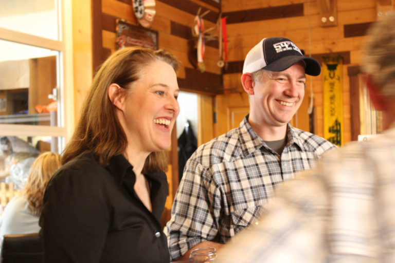 Congressional candidate Carolyn Long (left) talks to supporters at a fundraiser held May 9 at 54?40' Brewing Company in Washougal.