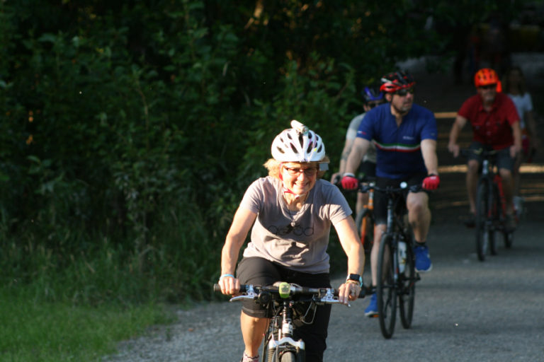 Jan Verrinder shows her support of Camas Bike and Sport by taking part in the anniversary ride at Captain William Clark Park in Washougal.