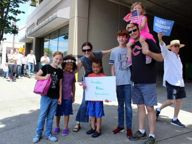 Ken Mach (second from right in black Camas shirt), of Camas, attends the June 30 Families Belong Together march in downtown Vancouver with his wife, Chelsey (third from left) and their five children (from left to right): Matayah, Oliver, Asher, Parker and Hazel (on Ken's shoulders).