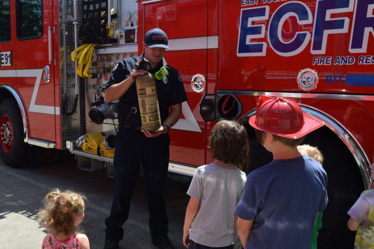 Children learn about the items that are on a fire engine during the East County Fire and Rescue open house, Sunday, July 29.
