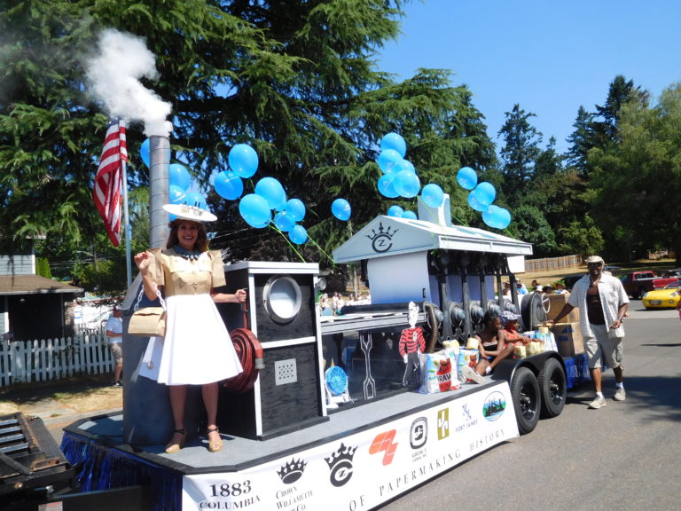 Caroline Mercury wears a paper dress on the grand prize winning Georgia-Pacific float in the Camas Days Grand Parade, July 28. Mercury and Terri Shanahan (not pictured) recreated the dress from photo archives of a Camas Paper Festival.