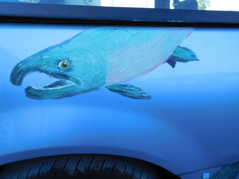 Washougal artist Travis London painted several salmon on his car, a 1990 Honda Civic, after he was involved in an accident.