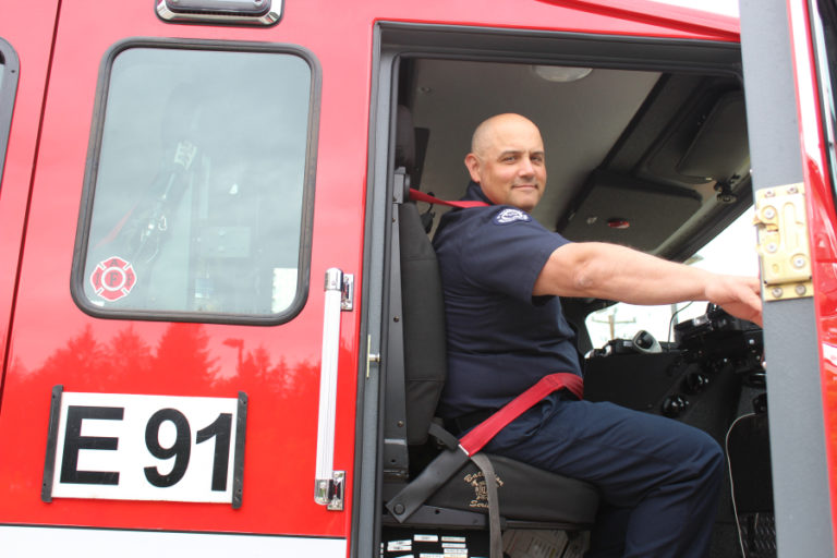 East County Fire and Rescue Fire Captain James Troutman looks down from the front seat of Station 91&#039;s fire engine on Friday, Aug. 24.