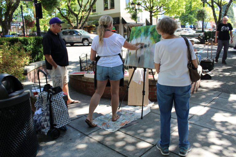 Visitors watch artist Heidi Curley paint during the 2017 Plein Air art event. Come see artists creating "in the open air" at this year's event, held throughout the day, Friday, Sept. 7, in historic downtown Camas.