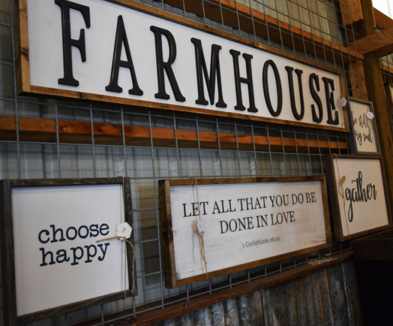 Handcrafted signs made by Honey BE Designs owner Kendra Christensen.