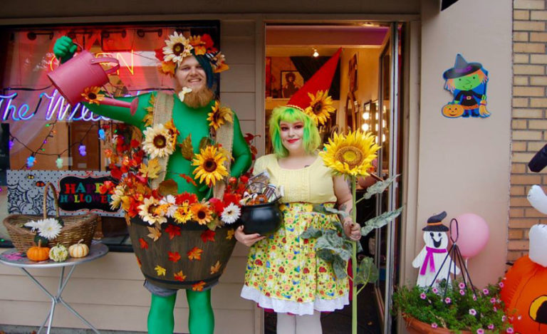 Caroline Mercury (second from left) and Georgia-Pacific employees hand out candy during the 2017 Boo Bash trick-or-treat event in downtown Camas.