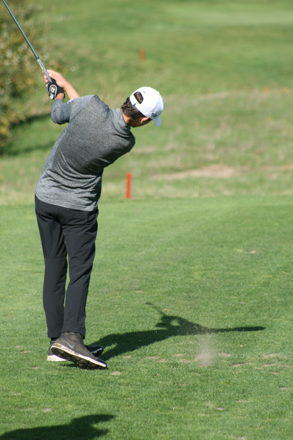 Camas no. 1 Owen Huntington strikes an iron and puts the ball within 10 feet of the pin on no.