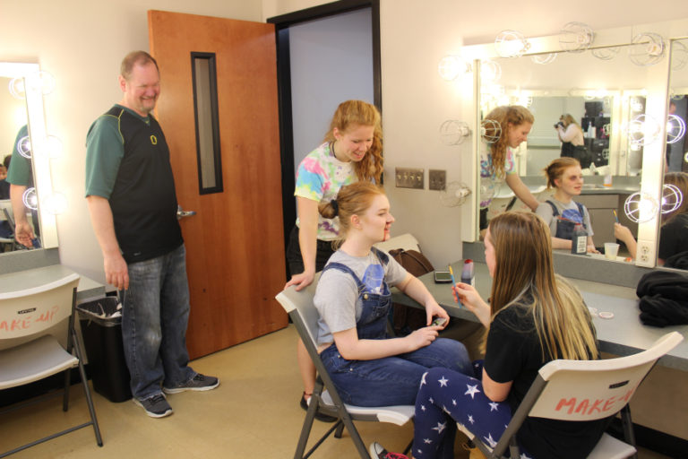 Washougal High School (WHS) drama teacher Kelly Gregersen (left) laughs with students Tori Corkum (second from left), Emma Free (second from right) and Aubrey Turner (right) during a prop-building day for the WHS drama department's 2018 haunted house on Oct. 20.