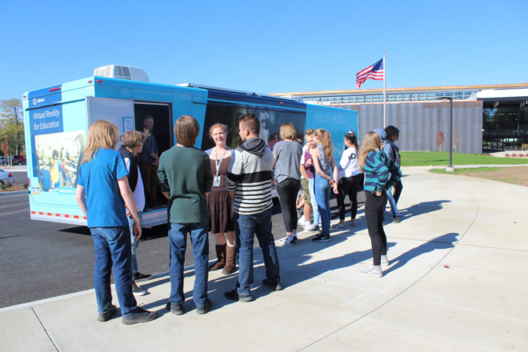 Discovery High School science teacher Heather Tricola (fourth from left) stands with a group of Discovery freshmen Oct.