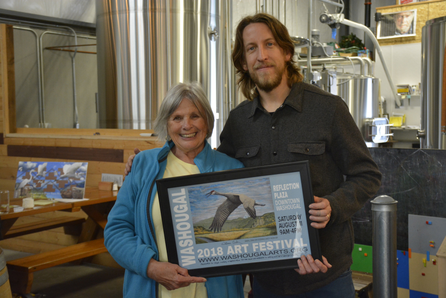 The Washougal Arts and Culture Alliance (WACA) honors former Washougal City Councilwoman Joyce Lindsay and street artist Travis London during a 'Celebration of the Arts' reception, Nov. 3, at 54?40' Brewing Co., in Washougal. London was recognized for the art he has added to several buildings in Washougal and Camas, and Lindsay, a WACA board member, was thanked for bringing high quality public art to Washougal. (Contributed photos courtesy of Rene Carroll)