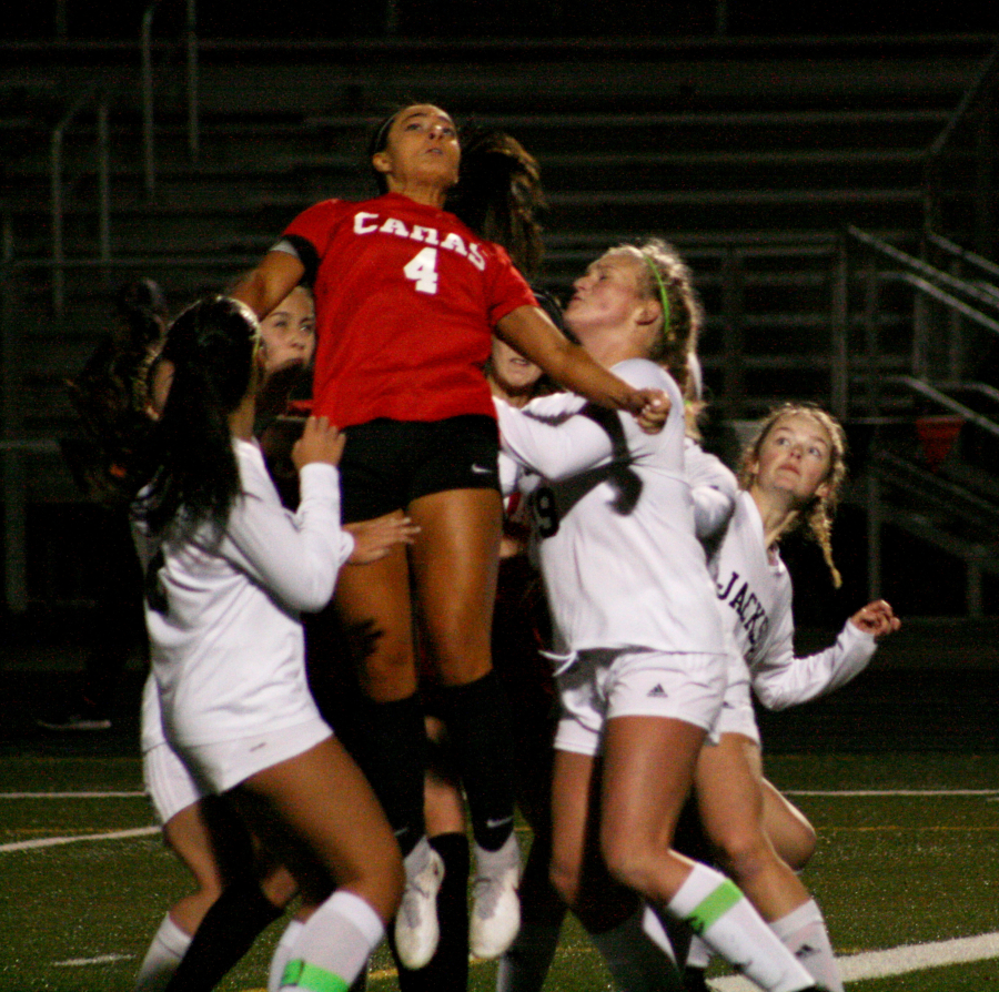 Maddie Kemp rises for a header near the net.  She continues to score and lead her team while managing a hamstring injury.  The Papermakers all-time goal leader will play for Gonzaga University next year.