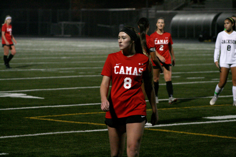 Jazzy Paulsen looks to Camas coach Roland Minder for the next play against Jackson at Doc Harris Stadium, Nov. 7.