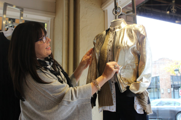 Dawn Stanchfield, owner of Lily Atelier boutique in downtown Camas, adjusts a mannequin decked out for the holidays on Nov. 15, inside her shop at 237 N.E.