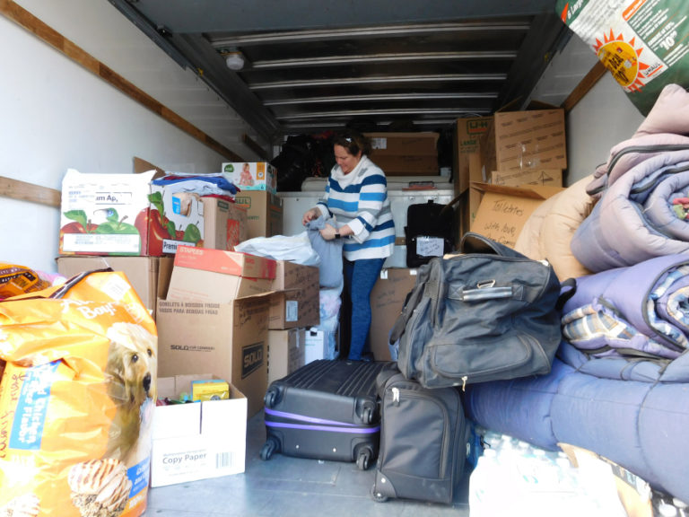 Nikki Dufner, of Camas, helps pack a rental truck, full of sleeping bags, blankets and food, on Friday, Nov. 16, for Northern Californians affected by wildfires, including the Camp Fire, which has destroyed the town of Paradise, Calif., and killed at least 79 people. The supplies were transported to Portland that afternoon, and Justin Pratt, a trucker who has family members who have lost homes in Paradise and Magalia, Calif., took the donated items to the Hope Center in Oroville, Calif., on Saturday, Nov. 17.
