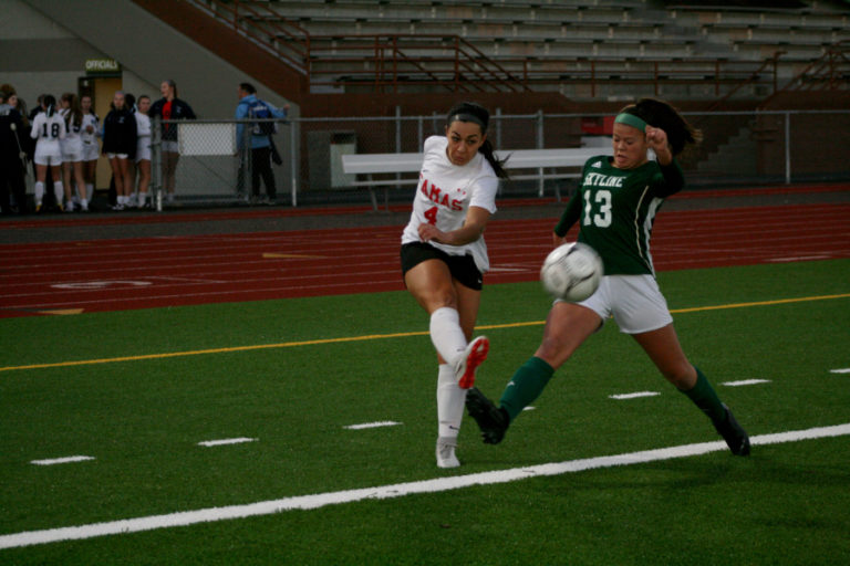 The Papermakers' Maddie Kemp, fires a shot on goal from long range that just misses during the state finals, Nov. 17.