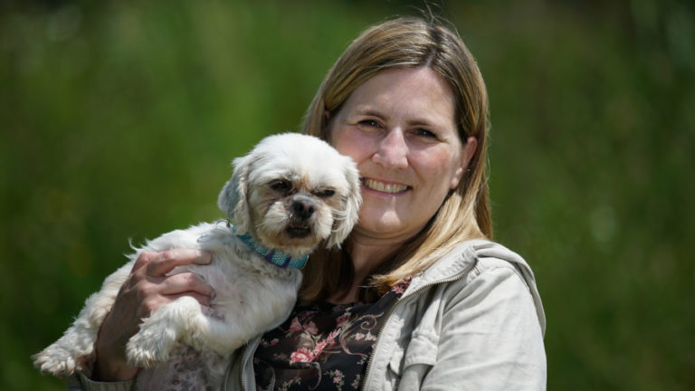 Kari poses for a photo with her newly adopted friend Marshmallow. Watch Kari and Marshmallow's story of rescue and adoption on "Amanda to the Rescue," at 9 p.m., Sunday, Dec. 16, on Animal Planet.