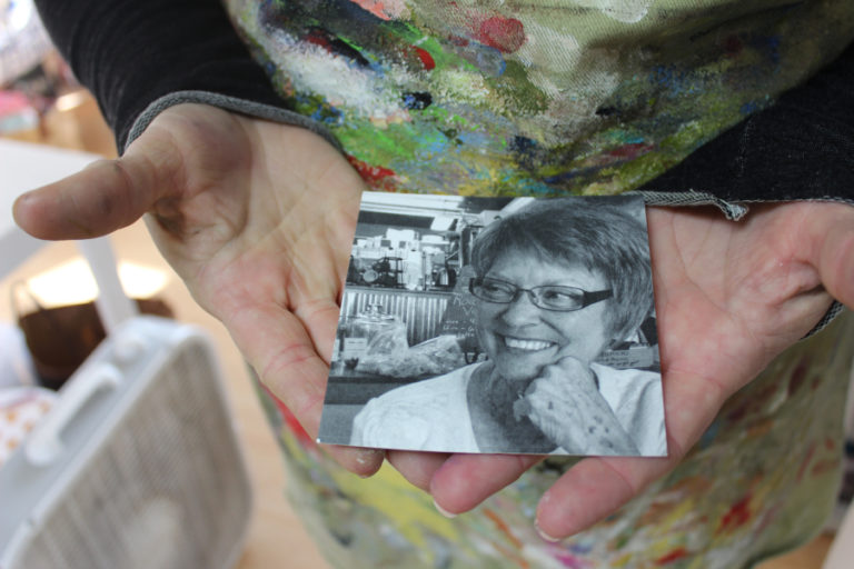 Heidi Jo Curley shows a photo of her mother, Lynne, who died in 2016.