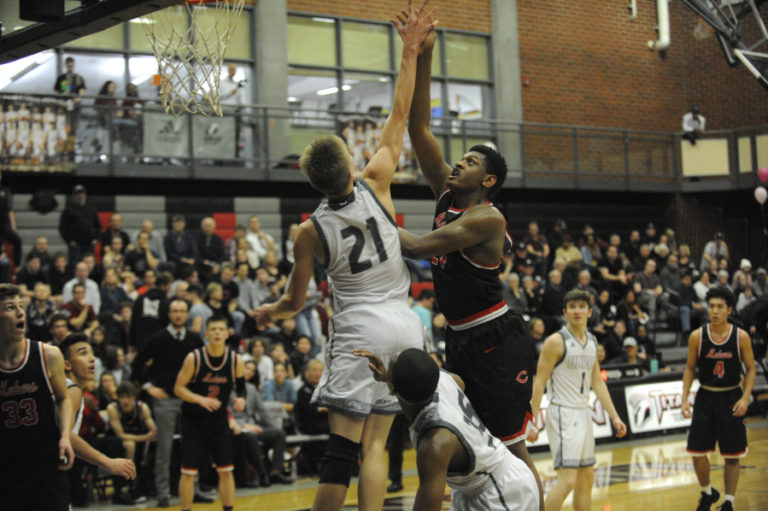 Camas High senior Isaiah Sampson draws a foul against the Union High Titans on Dec. 17.