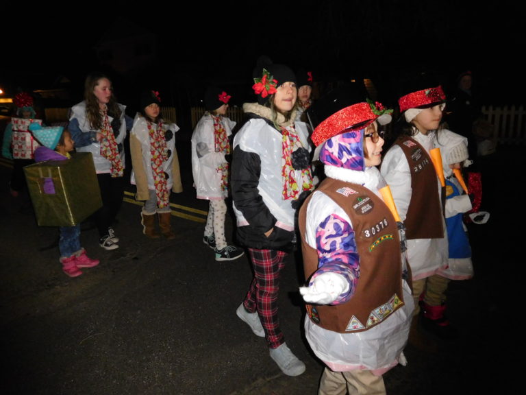 (Dawn Feldhaus/Post-Record) Local Girl Scouts march along Main Street in the annual Lighted Christmas Parade, presented by the City of Washougal and the Downtown Washougal Association, Dec. 6.