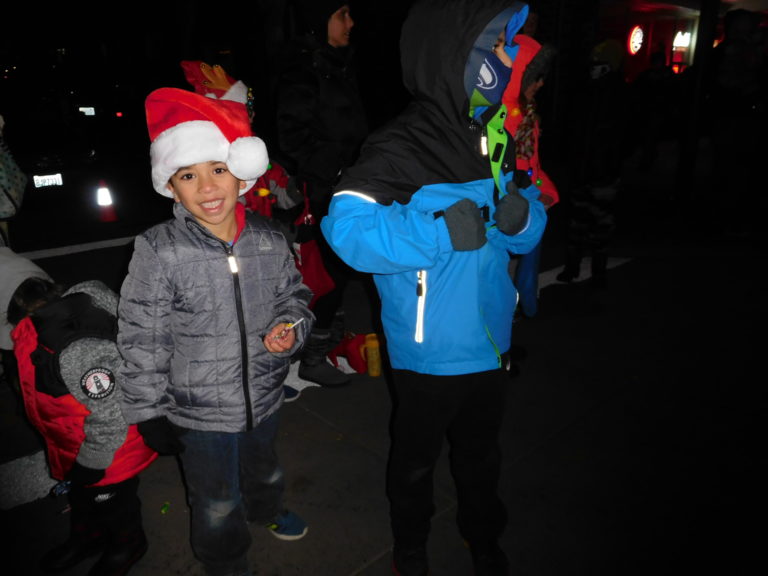 (Dawn Feldhaus/Post-Record) Washougal Christmas Parade watchers bundle up to watch the procession along Main Street while the temperatures were in the low to mid 30s.
