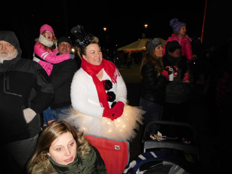 (Dawn Feldhaus/Post-Record) Washougal Christmas Parade watchers bundle up to watch the procession along Main Street, Thursday, Dec. 6.