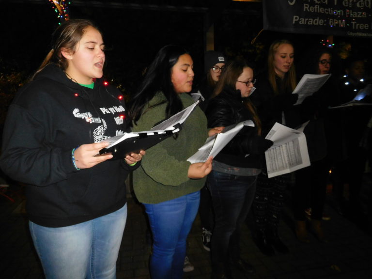 (Dawn Feldhaus/Post-Record) The Washougal High School choir entertains the crowd before the Christmas tree lighting in Reflection Plaza, Dec. 6.