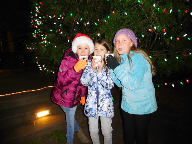 (Dawn Feldhaus/Post-Record) Local youth warm up with hot beverages after the lighting of the Washougal Christmas tree, Dec. 6, in Reflection Plaza.