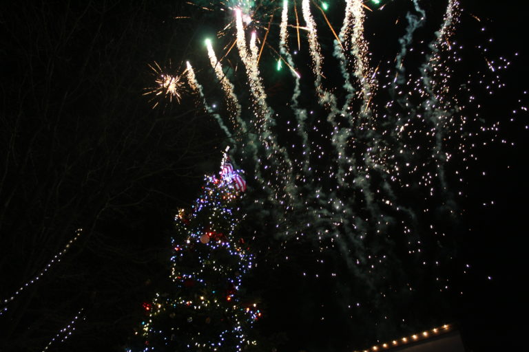 Fireworks light the sky above the just-lit Christmas tree in downtown Camas at the 2018 Hometown Holidays event, Friday, Dec. 7.
