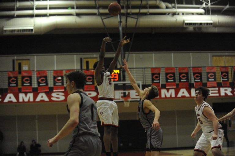 Camas forward senior Isaiah Sampson shoots a 3-pointer against Union on Jan. 18.