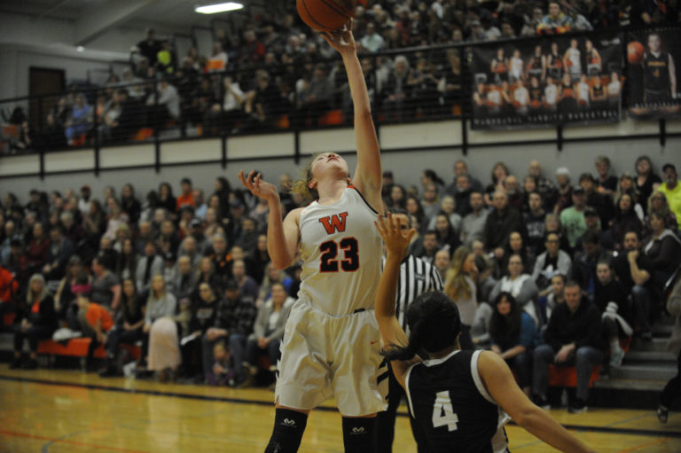 Panther guard Sammy Mederos makes a layup over a Woodland defender on Thursday, Jan.