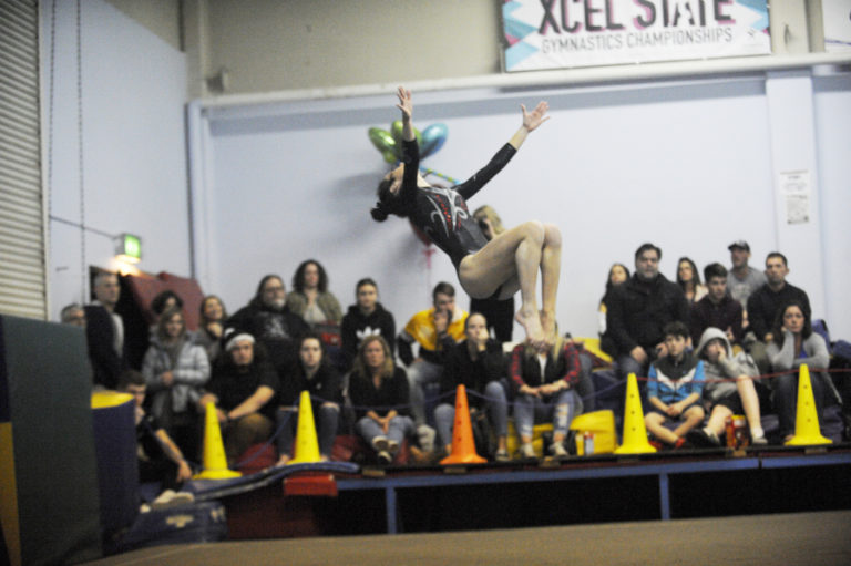 Camas gymnast Grace Alonzo thrills the home crowd with a high altitude move during the floor excercise at the meet before the postseason.