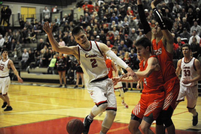 Camas senior Carson Bonine is fouled during a drive to the hoop Jan.