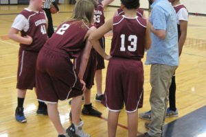 Canyon Creek Middle School boys basketball coach Jason Barnes talks to his team after the first quarter of the Coyotes' game against King's Way Christian in Vancouver on Feb. 27. The Washougal middle school athletic teams will play in a new league next school year. 