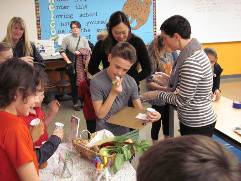 Coleman Multanen eats a vegetable during Washougal School District's Family Fitness Night, held Feb.
