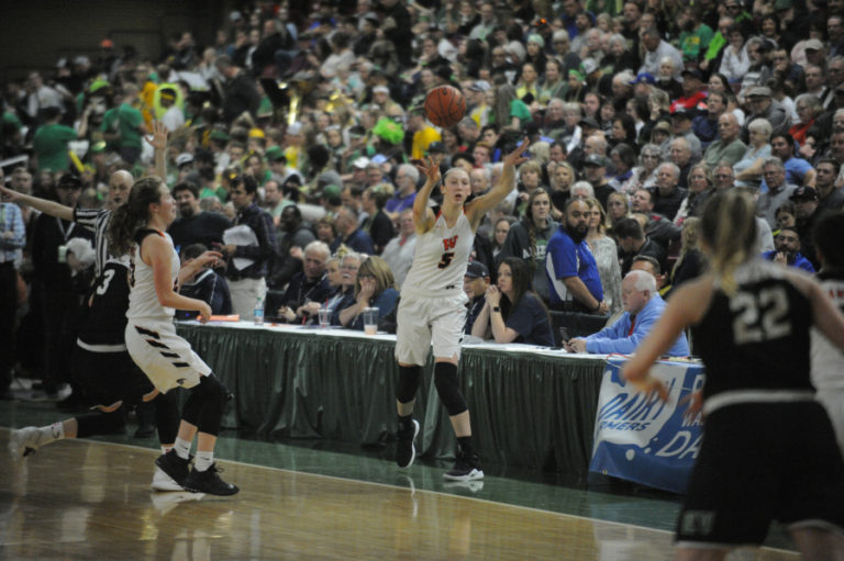 Beyonce finds the open player under the basket during an inbound play in the fourth quarter of the state championship game against East Valley of Spokane.