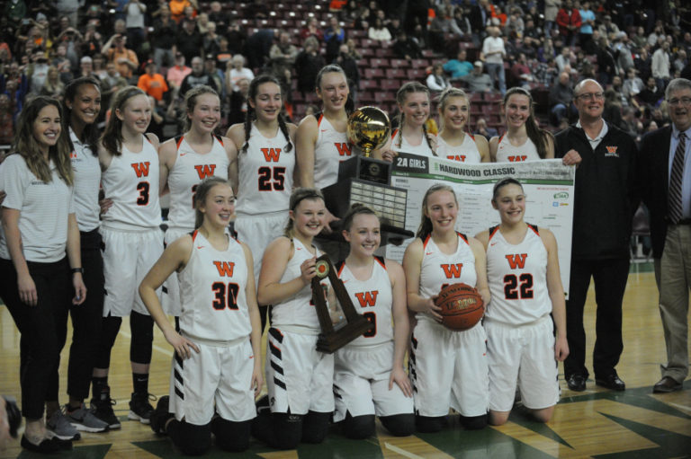 The Panthers pose for historic photos of the schools first ever state championship in basketball.