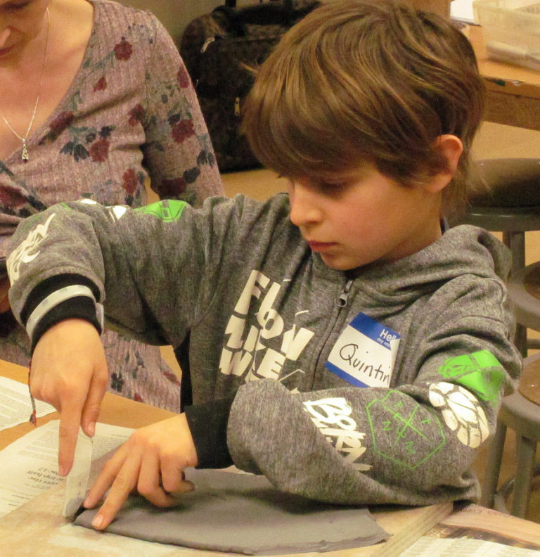 Quintin Haggerty works on a project during a pottery class March 6 at Washougal High School.