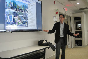Roy Kim of RKm Development talks about his previous projects at Port of Camas-Washougal meeting April 15. 