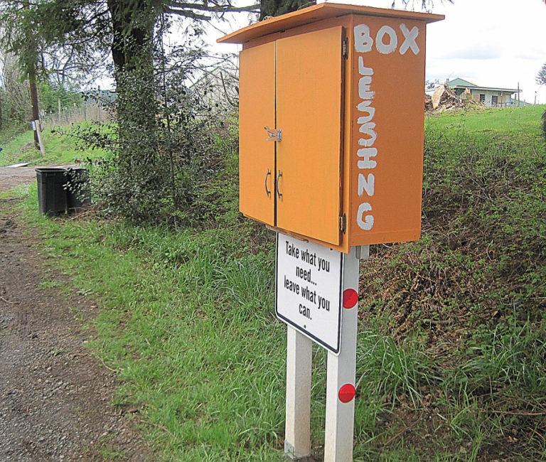 The Fern Prairie United Methodist Church&#039;s blessing box features a sign with simple instructions.