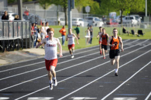 Camas senior Blake Derringer finishes strong in the 400 meters against Battle Ground on April 30. Derringer specializes in the 100 meters, but his talent in the 400 gives the Camas team more options as they defend the state track and field title.