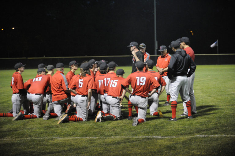 Head coach Stephen Short (center) shares some wisdom about the upcoming state tournament with his team after a 3-1 win over Auburn Mountainview.